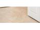Close up of the neutral tile and white baseboards at 4838 Sevilla Shores Dr, Wimauma, FL 33598
