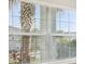 Bright window offers lots of light and views of the lush landscaping and palm trees at 4838 Sevilla Shores Dr, Wimauma, FL 33598