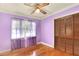 Bedroom with light purple walls, hardwood floors, and double doors at 731 E Lumsden Rd, Brandon, FL 33511