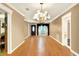 Bright dining room featuring hardwood floors and chandelier at 731 E Lumsden Rd, Brandon, FL 33511