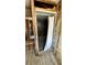 Bathroom featuring a stone shower with glass door under construction with exposed framing at 6138 Island Dr, Weeki Wachee, FL 34607