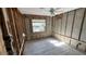 Bedroom view shows updated flooring, block walls, window to the exterior, and ceiling fan at 6138 Island Dr, Weeki Wachee, FL 34607
