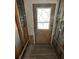 Entryway with stylish door and visible wall framing, offering renovation potential at 6138 Island Dr, Weeki Wachee, FL 34607