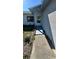 Exterior angle shot of a home with a ramp leading to the front door at 6138 Island Dr, Weeki Wachee, FL 34607