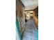 Open-concept interior with wood floors and visible wall framing at 6138 Island Dr, Weeki Wachee, FL 34607