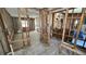 View of a house under construction with exposed framing and wood-look flooring at 6138 Island Dr, Weeki Wachee, FL 34607
