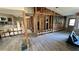 Open-concept living room/kitchen under construction featuring exposed framing and wood-look flooring at 6138 Island Dr, Weeki Wachee, FL 34607