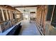 Spacious living room under construction featuring exposed framing, high ceilings, and wood-look flooring at 6138 Island Dr, Weeki Wachee, FL 34607