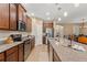 Modern kitchen with granite countertops and stainless steel appliances at 133 Villa Preserve Ave, Lutz, FL 33548