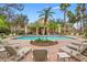 Refreshing community pool with lounge chairs and patio at 133 Villa Preserve Ave, Lutz, FL 33548