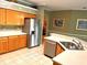 Kitchen with stainless steel appliances and wood cabinets at 13102 Prestwick Dr, Riverview, FL 33579