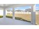 View of the home's spacious, private backyard from the covered back patio perfect for enjoying the outdoors at 10288 Surrey Rose Dr, San Antonio, FL 33576