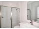 A pristine bathroom featuring a glass-enclosed shower, modern fixtures, and stylish finishes at 10288 Surrey Rose Dr, San Antonio, FL 33576
