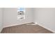 Carpeted room with natural light from window at 10288 Surrey Rose Dr, San Antonio, FL 33576