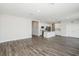 The seamless floor plan is enhanced by stylish flooring and a modern kitchen island at 10288 Surrey Rose Dr, San Antonio, FL 33576