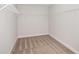 Walk-in closet with carpet and wire shelving providing ample storage solutions at 10288 Surrey Rose Dr, San Antonio, FL 33576