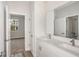 Double vanity bathroom with modern finishes and a view to bedroom at 10317 Fieldstone Myrtle Way, San Antonio, FL 33576