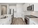Modern kitchen with white cabinets, stainless steel appliances and an island at 10317 Fieldstone Myrtle Way, San Antonio, FL 33576