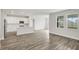 Modern kitchen with white cabinets, island, and hardwood floors at 10317 Fieldstone Myrtle Way, San Antonio, FL 33576