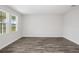 Spacious living room featuring hardwood floors and neutral walls at 10317 Fieldstone Myrtle Way, San Antonio, FL 33576