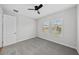 Comfortable carpeted bedroom with natural light and ceiling fan at 9120 Warm Springs Cir, Parrish, FL 34219