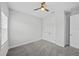 Simple bedroom featuring soft carpet, double door closet and ceiling fan at 9120 Warm Springs Cir, Parrish, FL 34219