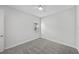 Serene carpeted bedroom with a ceiling fan and natural light at 9120 Warm Springs Cir, Parrish, FL 34219