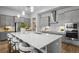 Bright, modern kitchen with stainless steel appliances, and a large island at 9120 Warm Springs Cir, Parrish, FL 34219