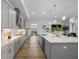 Spacious kitchen featuring an island, stainless steel appliances and stylish pendant lighting at 9120 Warm Springs Cir, Parrish, FL 34219