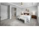 Bright main bedroom features neutral walls, carpet flooring, and doorway to the main bathroom at 9120 Warm Springs Cir, Parrish, FL 34219