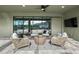 Covered outdoor living area offers cozy seating and a view of the outdoor living space at 9120 Warm Springs Cir, Parrish, FL 34219