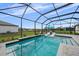 Screened pool area features a modern pool, lounge chairs, and well-maintained landscaping at 9120 Warm Springs Cir, Parrish, FL 34219