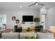 Cozy sitting area with comfortable armchairs and a large TV at 9120 Warm Springs Cir, Parrish, FL 34219