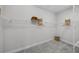 Walk-in closet with wire shelving and carpet flooring at 9120 Warm Springs Cir, Parrish, FL 34219