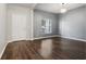 Bright entryway with wood-look floors and neutral walls at 8550 Creedmoor Ln, New Port Richey, FL 34654