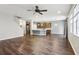 Bright living room features hardwood floors and an open concept floorplan at 8550 Creedmoor Ln, New Port Richey, FL 34654