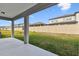 Back yard and covered patio perfect for entertaining, with a privacy fence at 20761 Balsam Hill Rd, Land O Lakes, FL 34638