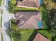 Aerial view of a private residence with a backyard pool and lush landscaping at 5621 Rock Dove Dr, Sarasota, FL 34241