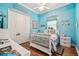Bright bedroom with beach theme, white furniture, and wood floors at 5621 Rock Dove Dr, Sarasota, FL 34241