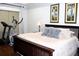 Bedroom with a large bed, exercise equipment, and natural light at 5621 Rock Dove Dr, Sarasota, FL 34241