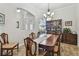 Dining room featuring a large table, china cabinet, and view into the entry at 5621 Rock Dove Dr, Sarasota, FL 34241