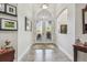 Bright foyer with decorative glass double doors and arched transom window providing lots of natural light at 5621 Rock Dove Dr, Sarasota, FL 34241
