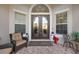 Inviting front porch featuring a seating area and seasonal decor at 5621 Rock Dove Dr, Sarasota, FL 34241