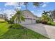 Home featuring a spacious two-car garage and brick paver driveway at 5621 Rock Dove Dr, Sarasota, FL 34241