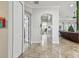 Hallway offering seamless access and views into the expansive living room at 5621 Rock Dove Dr, Sarasota, FL 34241