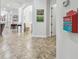 Hallway with tiled floor and decorated wall at 5621 Rock Dove Dr, Sarasota, FL 34241