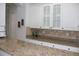 Kitchen wet bar with white cabinetry and countertop at 5621 Rock Dove Dr, Sarasota, FL 34241