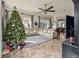 Spacious living room features tile floors, ceiling fan, large windows, and a sectional sofa at 5621 Rock Dove Dr, Sarasota, FL 34241