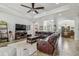Inviting living room featuring comfortable seating, tile floors, and plenty of natural light at 5621 Rock Dove Dr, Sarasota, FL 34241