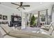 Comfortable living room with Christmas tree, large windows, and a sectional sofa at 5621 Rock Dove Dr, Sarasota, FL 34241